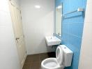 Clean bathroom with white and blue tiles