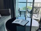 Modern living room with a view of the ocean through floor-to-ceiling glass doors