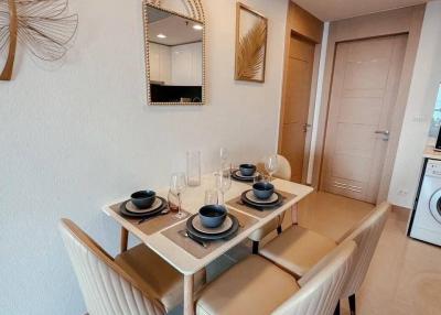 Modern dining area with a table set for four and decorative elements