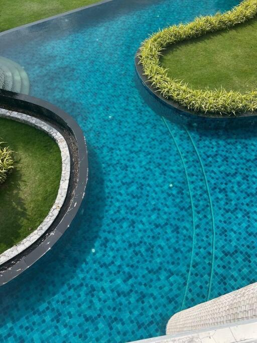 Luxurious outdoor swimming pool with landscaped garden