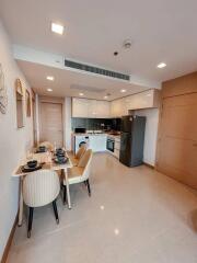Modern kitchen with integrated dining area in a newly furnished apartment