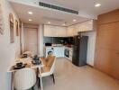 Modern kitchen with integrated dining area in a newly furnished apartment