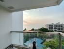 Cozy balcony with seating overlooking the ocean and sunset