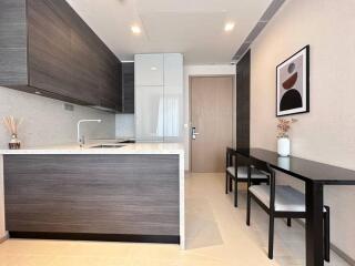 Modern kitchen with sleek cabinetry and integrated appliances