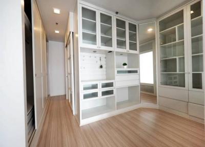 Modern kitchen with white cabinetry and wooden flooring