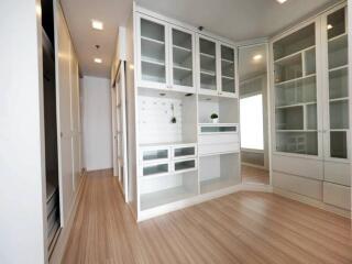 Modern kitchen with white cabinetry and wooden flooring