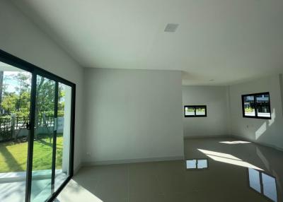 Spacious living room with large windows and natural light