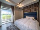 Cozy bedroom with natural light and balcony access