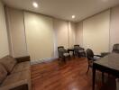 Spacious dining area with large table and hardwood floors