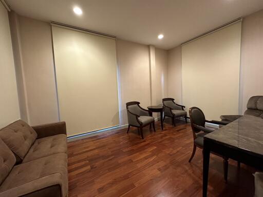 Spacious dining area with large table and hardwood floors