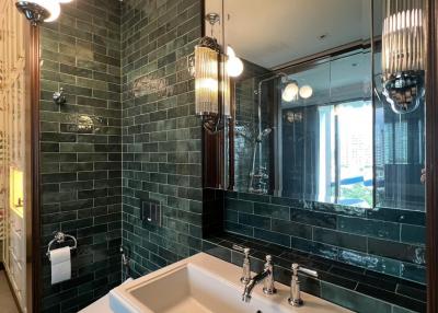 Elegant bathroom interior with freestanding tub and green subway tiles