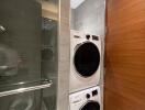 Modern bathroom with stacked washer and dryer and sleek finishes