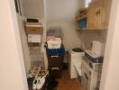 Compact laundry room with storage space and appliances