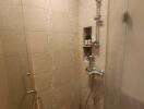 Modern bathroom with walk-in shower and beige tiles