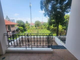 Spacious balcony with a view of a well-maintained garden