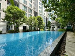 Residential building complex with outdoor swimming pool and garden