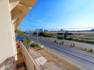 View from the balcony showing surrounding area and roads