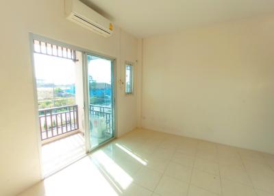 Bright and airy bedroom with balcony access and air conditioning