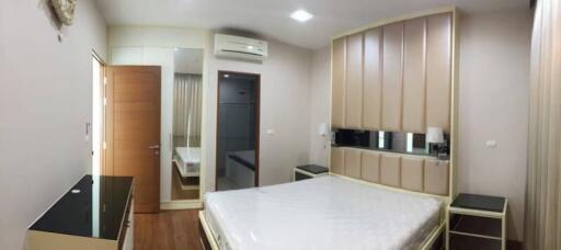 Spacious bedroom with modern furniture and ample storage