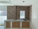 Modern kitchen with mosaic backsplash and wooden cabinets