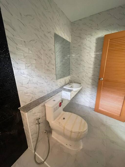 Modern bathroom with marble walls and flooring