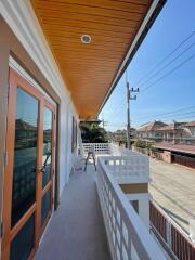 Spacious balcony with a view of the residential neighborhood