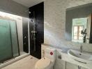 Modern bathroom with shower and marble tiles