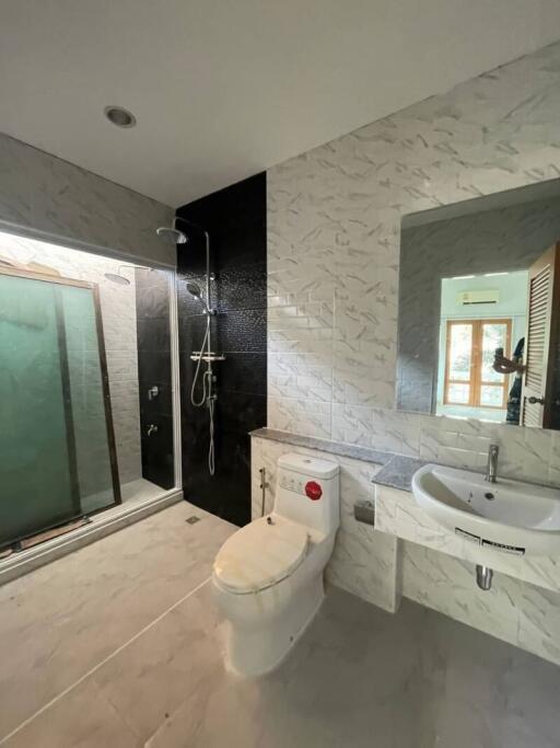 Modern bathroom with shower and marble tiles