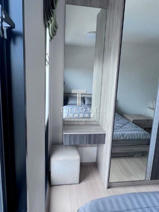 Modern bedroom interior with large mirror and comfortable bedding