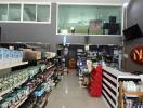 Spacious and well-stocked interior view of a retail store with shelves full of products