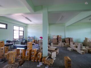 Spacious building interior with numerous boxes