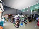 Spacious store interior with shelving stocked with products