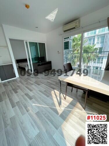 Bright living room with modern furniture and balcony access