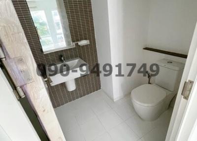 Modern bathroom interior with brown mosaic tiles