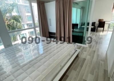 Spacious living room with natural light and balcony access