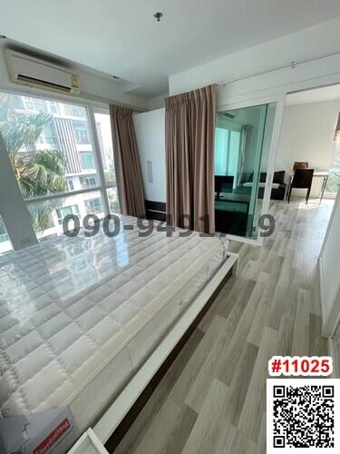 Spacious living room with natural light and balcony access