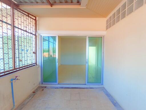 Patio area with sliding glass doors leading to interior