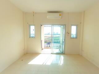 Bright and empty living room with balcony access