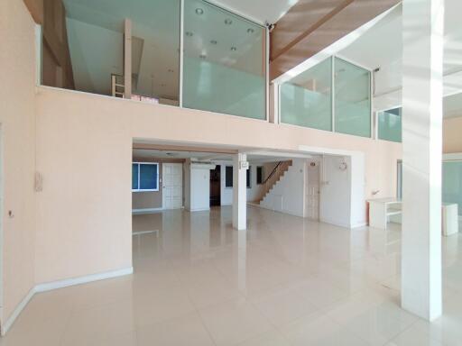 Spacious modern interior with an open floor plan, bright with ample natural lighting