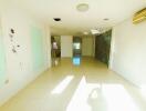 Bright spacious empty interior of a building with tiled floors and large windows