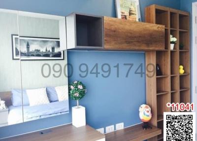 Modern living room interior with blue walls and wooden shelving