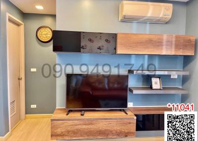 Modern living room with television and wooden furnishing