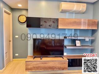 Modern living room with television and wooden furnishing