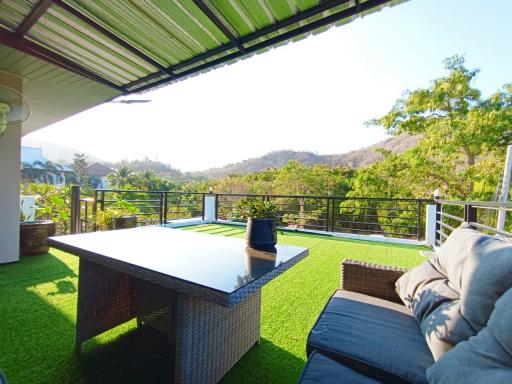 Spacious balcony with beautiful hillside views