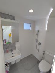 Bright bathroom with modern fixtures and a small window