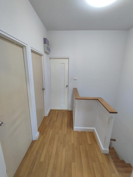 Bright hallway with wooden flooring