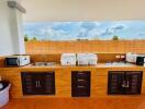 Modern kitchen with wooden cabinets and terra cotta tiles