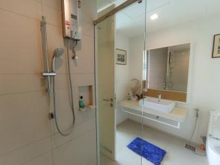 Spacious bathroom with walk-in shower and modern amenities