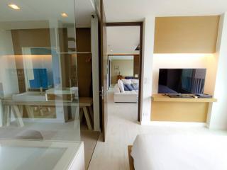 Modern bedroom with ensuite bathroom and television