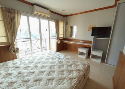 Spacious bedroom with natural light and modern amenities